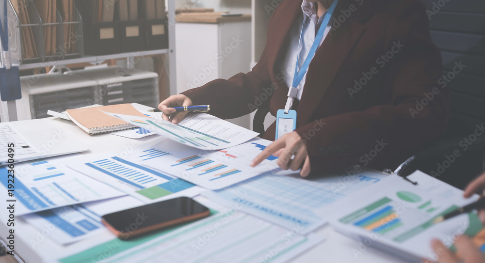 Fototapeta premium Accounting company provide finance and taxation planning for profitable cash flow, Auditor and accountant team working in office, analyze financial data and accounting record with calculator