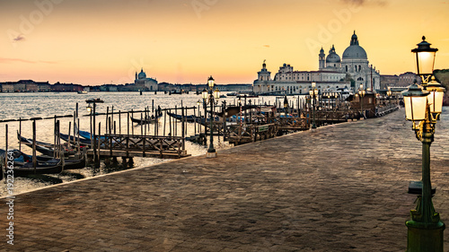 The photograph depicts St Mark's Square (Piazza San Marco) in Venice. Dominating the square is the bell tower (Campanile di San Marco)