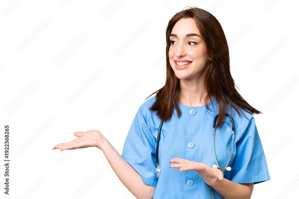 Fototapeta premium Young nurse woman over isolated chroma key background with surprise facial expression