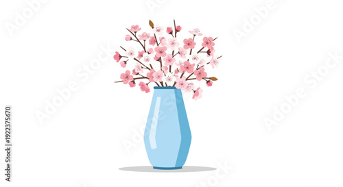 A light blue geometric vase filled with delicate pink cherry blossom branches.