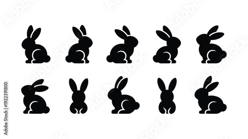 Collection of adorable black bunny silhouettes in various poses on white background for easter or spring designs