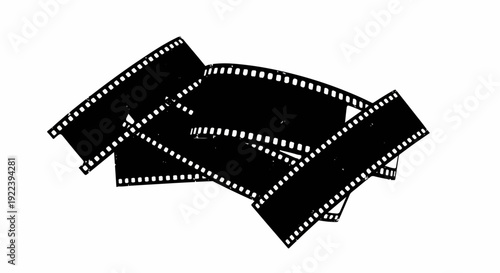 Tangled black film strips with perforations on a white background
