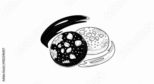 Two circular items decorated with floral patterns and seeds, with abstract shapes