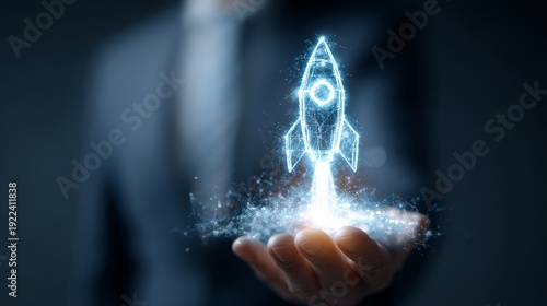 a businessman holding a glowing rocket hologram in his hand