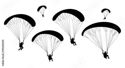 Multiple Silhouettes of Parachutists Descending with Colorful Parachutes