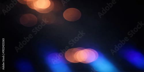 Abstract colorful bokeh of illuminated city traffic and Christmas decorations create a glowing blurred motion of lights in the dark night street