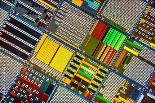 Silicon semiconductor wafer with integrated circuit die mosaic pattern.