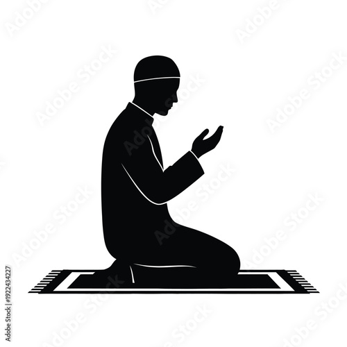 Silhouette of a Muslim man praying on a mat in sitting position