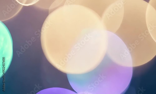Colorful bokeh effect. Multicolored light circles. Purple, green, and yellow bokeh. Abstract background texture. Glowing lights. Dark background. Blurred lights effect. Bokeh photography.