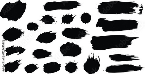 The image features a collection of almost black abstract brush strokes and splatters on a white background. This contrast enhances the visibility of each mark, allowing viewers to appreciate the varie