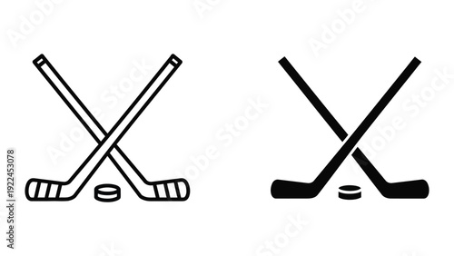 Hockey sticks and pucks crossed over