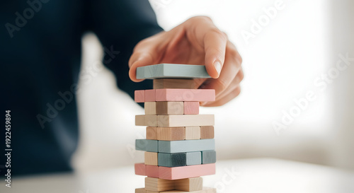 Wallpaper Mural Business Stability Growth Balance Concept Man Stabilizing Colored Wooden Block Tower Torontodigital.ca