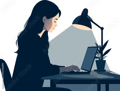 Woman working on laptop at night with warm desk lamp light