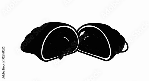 Sliced black pastry with white glaze and dripping filling