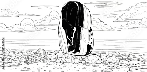 Striking dark and light stone monolith on a rocky beach with clouds