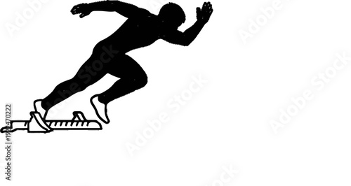 Silhouette of an athlete starting a sprint from a block