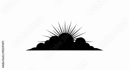 Silhouette of sunburst behind clouds
