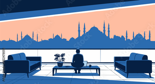 Man working on laptop in modern office lounge with city skyline view at sunset