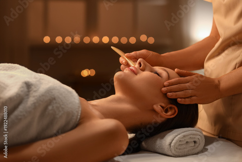 Young woman having facial m...