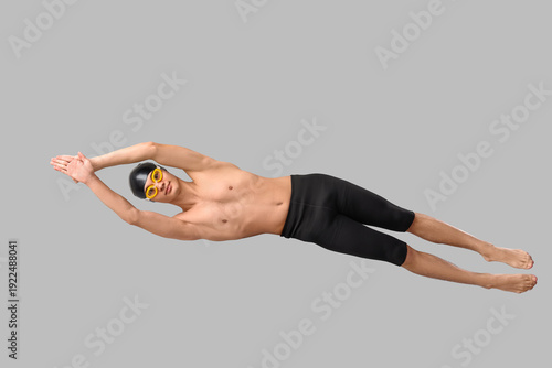 Male swimmer on light backg...