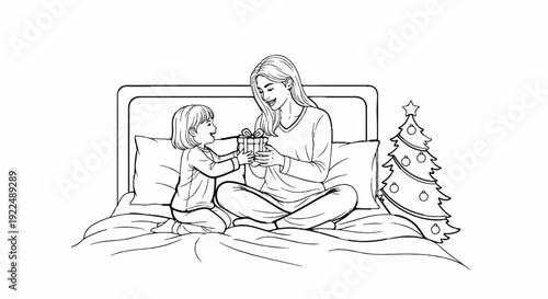 Mother and child exchanging a gift on a bed with a Christmas tree nearby