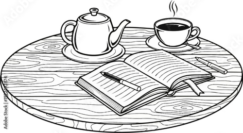 Open book and pen rest on a wooden table with steaming tea and a teapot
