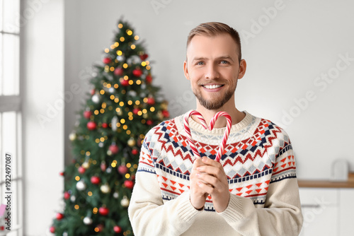 Young man in sweater with c...