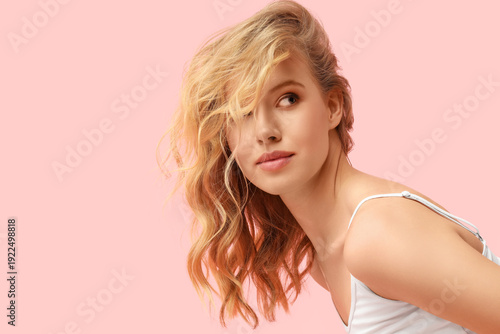 Blonde young woman with bea...