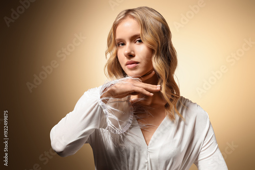 Blonde young woman with cur...