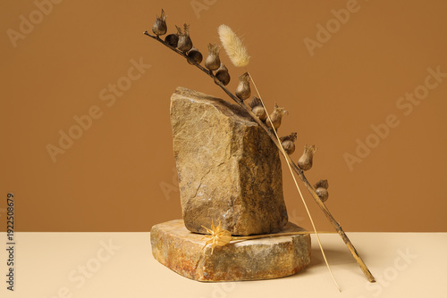 Dried flowers and stones on...