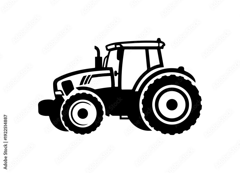 Fototapeta premium Modern tractor driving through field with large wheels