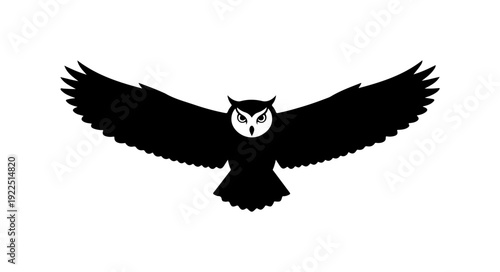 Majestic owl in mid flight with outstretched wings
