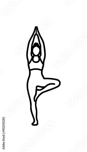 Woman in serene yoga pose standing on one leg in balance