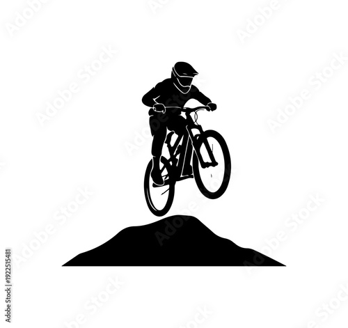 Thrilling mountain biker soaring through air on rugged trail
