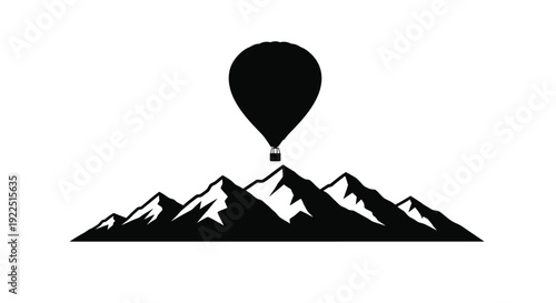 Mountain range with hot air balloon above a striking silhouette