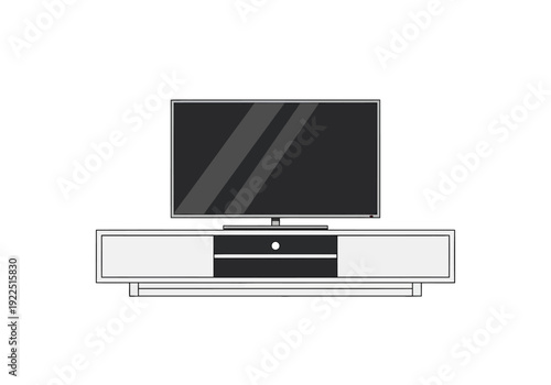Flatscreen television resting on a low modern entertainment stand