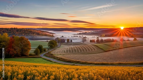 Scenic landscape of rolling hills, fields, and forests at sunset with a winding road