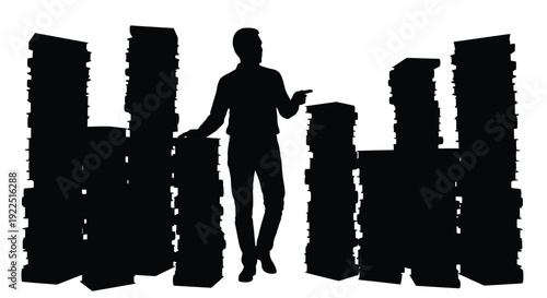 A person stands amidst abstract shapes creating a striking silhouette