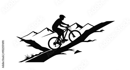 Mountain biker rides along a rocky ridge striking black silhouette