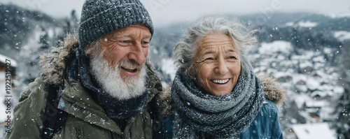 Elderly couple smiling in a snowy mountain town, enjoying winter outdoors together