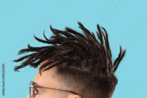 Young man with dreadlocks a...