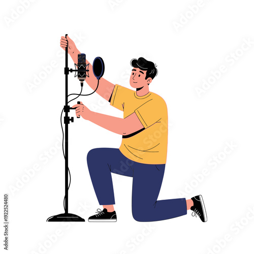 Person recording audio with a microphone and stand in a studio setting.