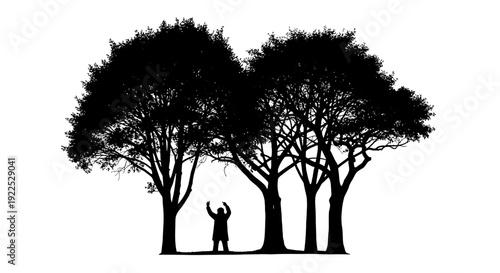 Man standing between three trees with arms raised in joy.