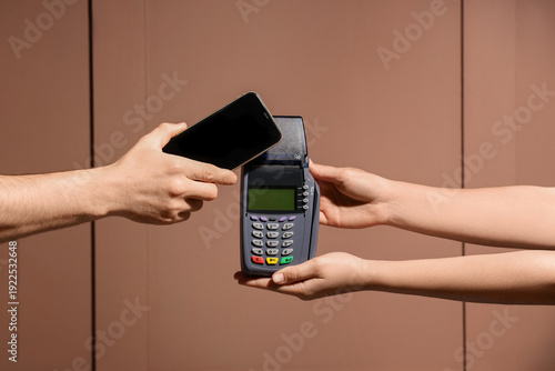 Hands with payment terminal...
