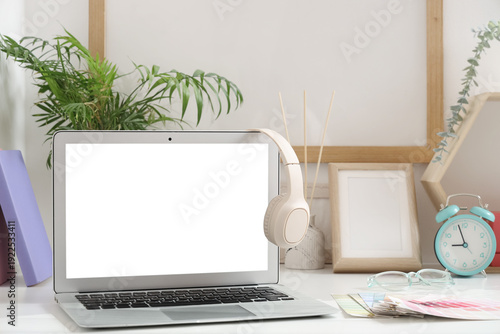 Blank laptop with headphone...