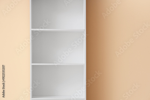 Empty white bookshelf near ...
