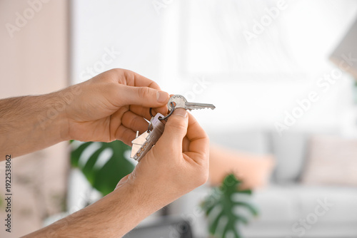 Male hands with key from ho...