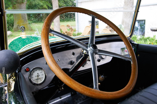 Vintage Car Interior with Rain-Splashed Windshield
