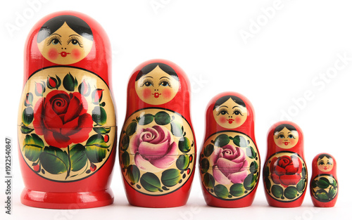 A set of traditional wooden Russian nesting dolls featuring painted red matryoshka babushka toys in a row isolated as a cultural souvenir group