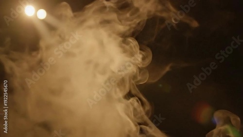 Smoke swirling under bright stage lights in a dark atmosphere  